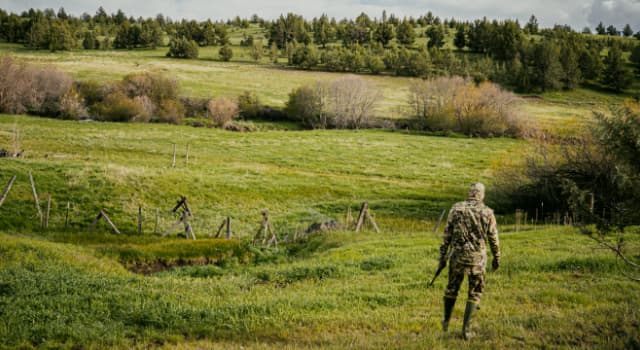 Man hunting in field
