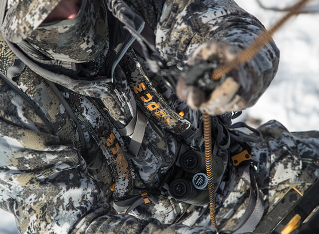 hunter descending tree with safety harness